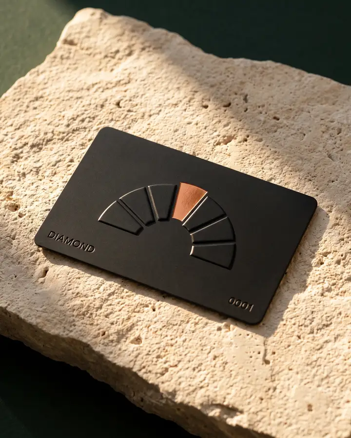 The Diamond tier in black with the Arch in relief and a copper keystone.